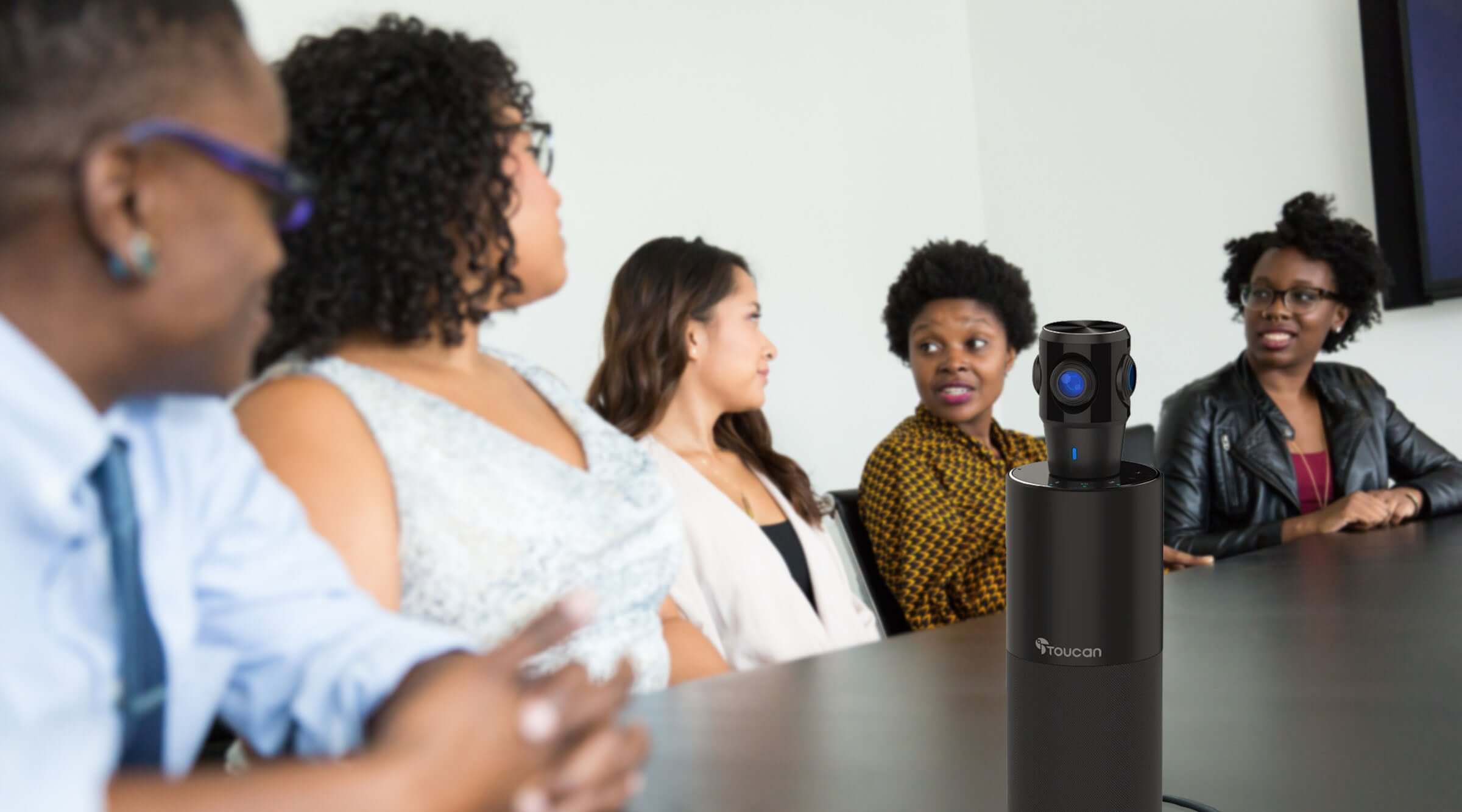 8 Reasons to Get the Toucan Video Conference System 360 | people having a meeting with a 360 conference camera on the table