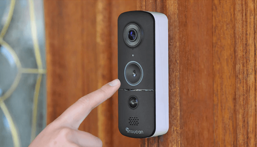 Why Wireless Video Doorbell Cams Make the Best Gift for Dad | Finger about to press Toucan Solutions' wireless video doorbell v3 installed by the front door