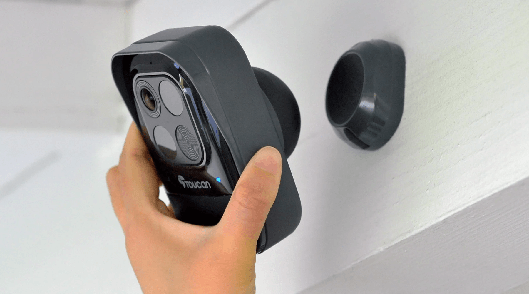 person installing the Toucan Wireless Security Camera PRO | Safeguard Your Business with Wireless Security Cameras