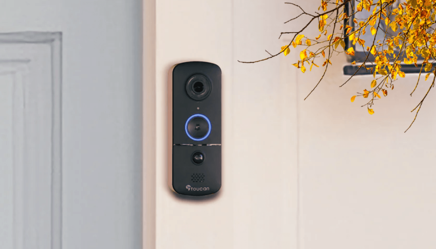 Why Fall is the Best Season to Boost Home Security | Toucan Wireless Video Doorbell V3 Includes Wireless Doorbell Chime installed beside a muted blue front door with a tree with fall leaves near it