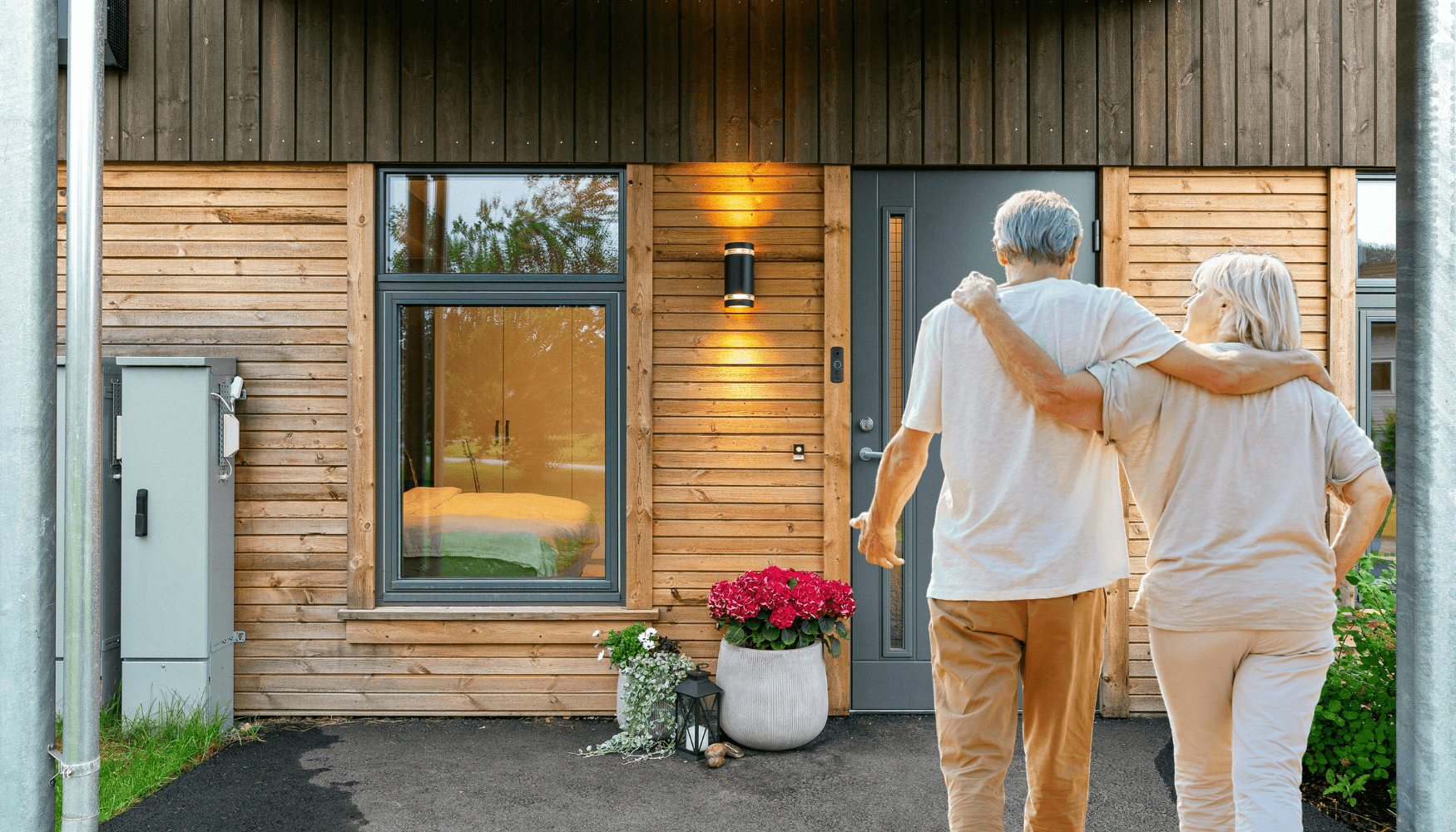 Doorbell Camera for Seniors - Best Wireless Doorbell V3 | elderly couple walking to the front of their house with gray door and the wireless doorbell camera v3 installed beside it