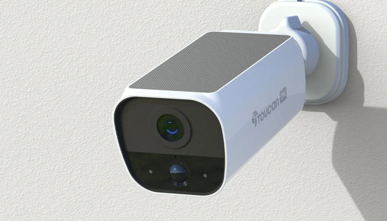 Toucan S5 installed on a white wall during daytime | Wireless Security Cameras