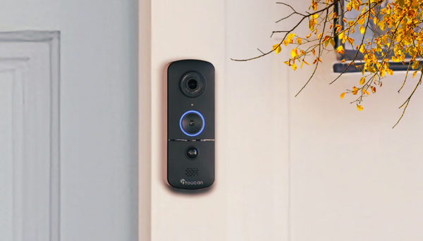Toucan Wireless Video Doorbell V3 Includes Wireless Doorbell Chime installed beside a muted blue front door with a tree with fall leaves near it