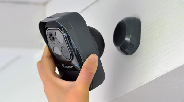 person's hand installing Toucan Wireless Security Camera PRO