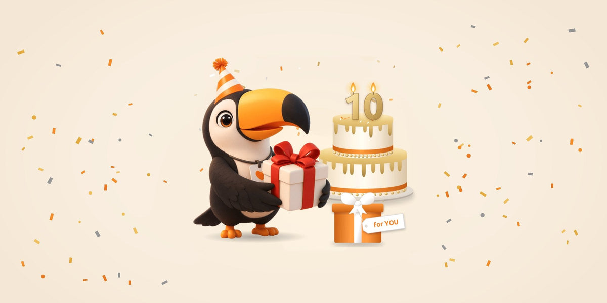 Toucan mascot in a party hat with a gift and a 10th birthday cake, celebrating Toucan's 10-year anniversary